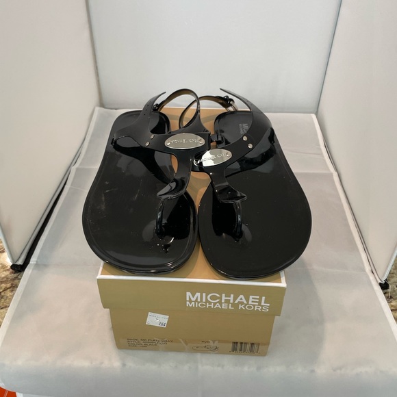 Michael Kors Shoes - Michael Kors Plate Jelly Black sandals